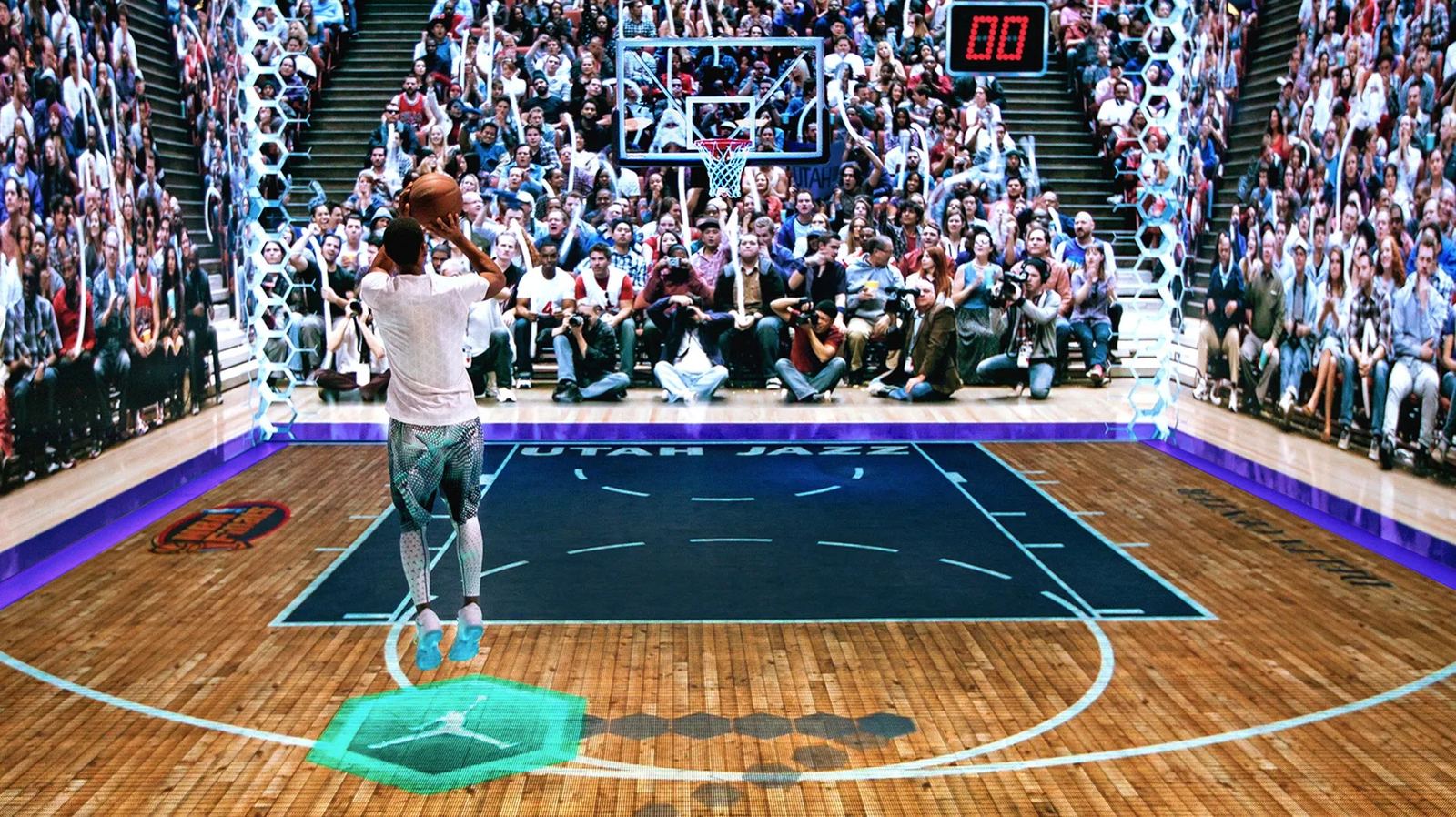 A player takes a buzzer-beater on the LED court as a projected crowd watches